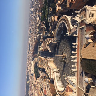 Aerial view of St. Peter's Square colonnade and obelisk